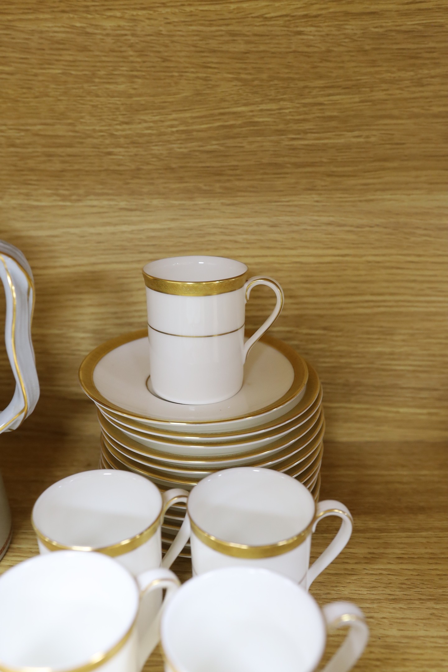 A Copeland fifteen piece coffee service, Trade Winds pattern, and a Doulton Royal Gold pattern coffee set